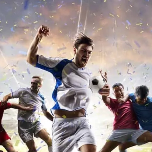 Footballeurs célébrant la victoire sous les confettis — France. Ligue 1 2026